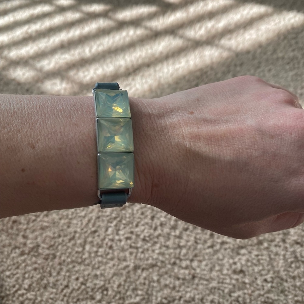 Gray bracelet with iridescent stones